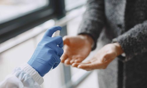 using hand sanitiser and PPE as a method of infection prevention and control